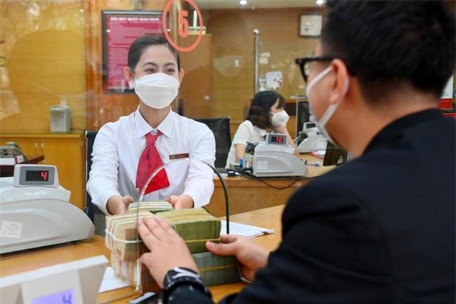 Ngân hàng vào cuộc đua tăng lãi suất, gửi tiền ở đâu nhận lãi cao nhất? - Ảnh 1.